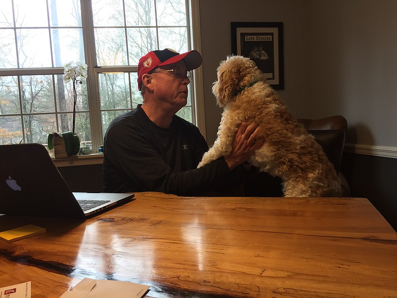 Times Free Press columnist Mark Kennedy adjusts to working at home with his dog Boise at his side. / Photo by Brooks Kennedy