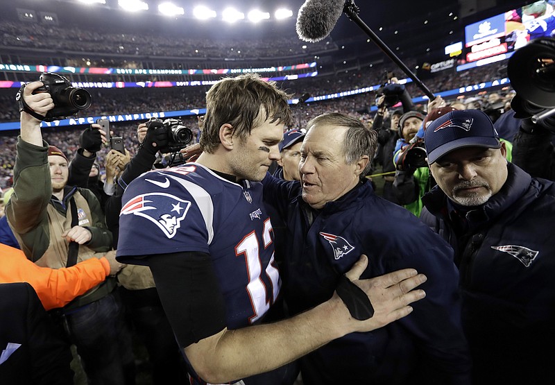 FILE - In this Jan. 21, 2018, file photo, New England Patriots quarterback Tom Brady, left, hugs coach Bill Belichick after the AFC championship NFL football game against the Jacksonville Jaguars, in Foxborough, Mass. Brady is an NFL free agent for the first time in his career. The 42-year-old quarterback with six Super Bowl rings said Tuesday morning, March 17, 2020, that he is leaving the New England Patriots. (AP Photo/David J. Phillip, File)