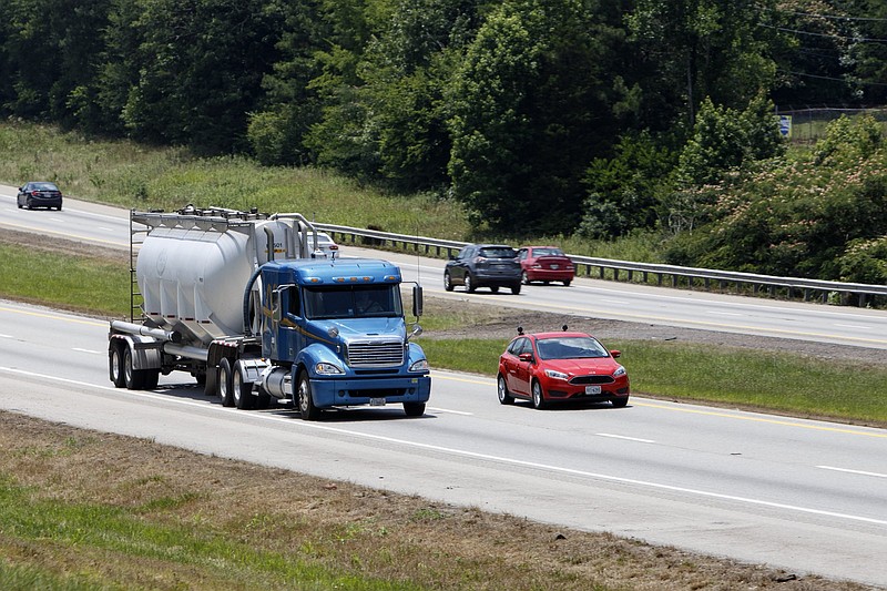 Staff photo by C.B. Schmelter / A tractor-trailer moves with traffic along I-75 North in Cleveland, Tenn.
