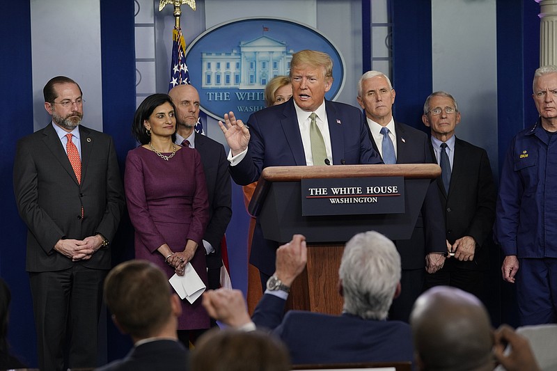 Doug Mills, The New York Times / President Donald Trump and members of the coronavirus task force address a news conference at the White House in Washington, Tuesday.