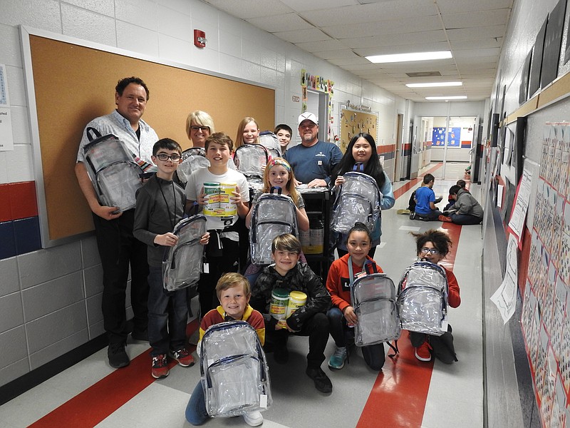 Contributed photo / Among Battlefield Elementary School students who helped Blue Smith collect school supplies to go into backpacks are Bianey Vidal, Ryan Itani, Mattie Hall, Bryce Schoenekase, Jacob Carter, Luke Butler, Minthy Tran, Maddox McDaniel, Kaylee Tate and Shepard Hayes; teachers David Camp and Ashlee Sims. Smith is in the back row, second from right.
