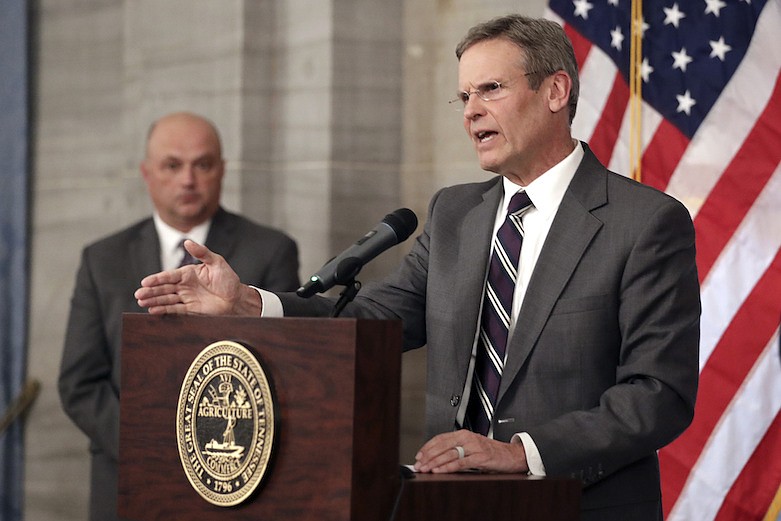 Tennessee Gov. Bill Lee, right, answers questions concerning the state's response to the coronavirus Monday, March 16, 2020, in Nashville, Tenn. Lee has asked all schools in Tennessee to close by the end of the week due to coronavirus spreading across the state. (AP Photo/Mark Humphrey)