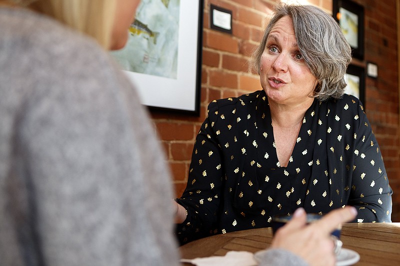 Staff photo by C.B. Schmelter / Stone Bridge Asset Management Director of Wealth, Knowledge and Happiness Stefanie Crowe, right, talks with client Merri Mai Williamson at Goodman's Coffee on Friday, Dec. 20, 2019, in Chattanooga, Tenn.