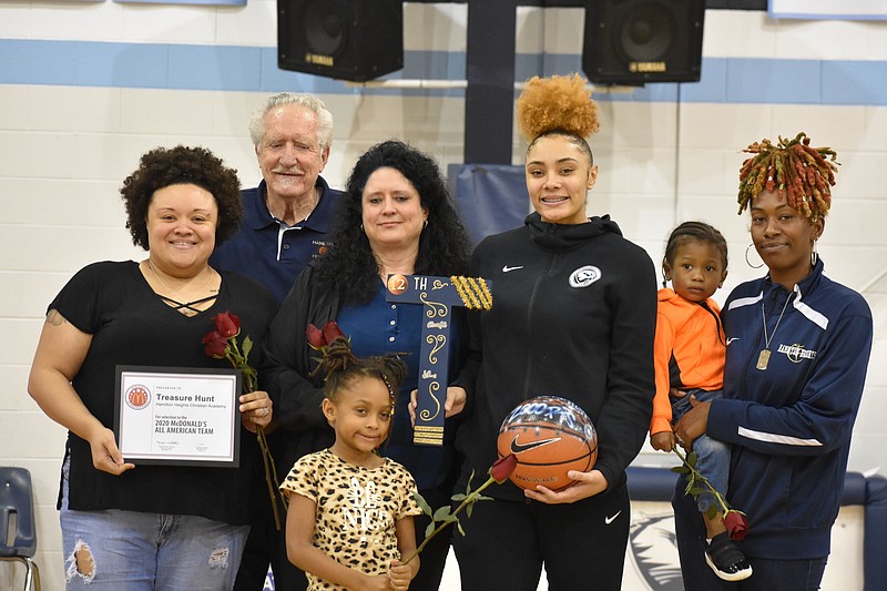 Staff photo by Patrick MacCoon / Hamilton Heights senior Treasure Hunt, third from right, is honored during senior night for the 2019-20 season.