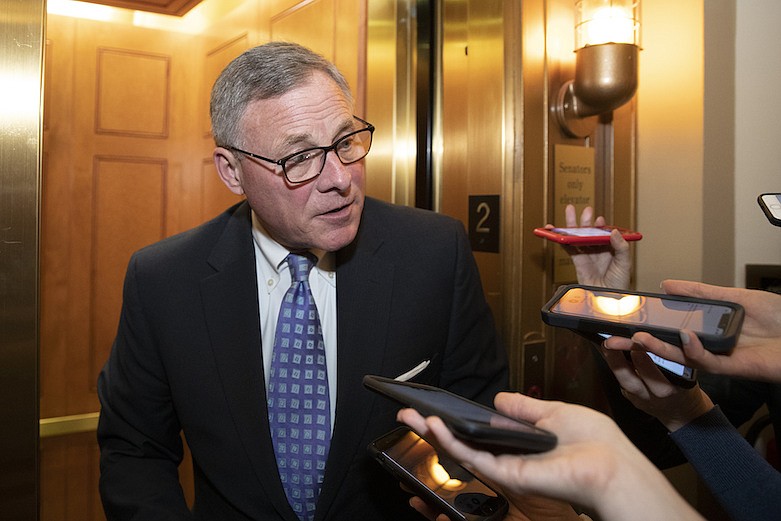 Sen. Richard Burr, R-N.C., speaks with reporters on Capitol Hill, Tuesday, Feb. 4, 2020 in Washington. (AP Photo/Alex Brandon)