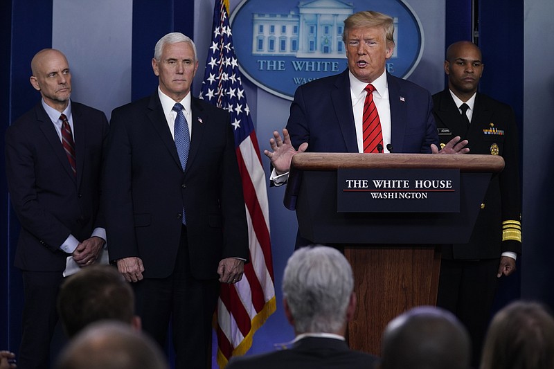 President Donald Trump speaks during press briefing with the coronavirus task force, at the White House, Thursday, March 19, 2020, in Washington. From left, Food and Drug Administration Commissioner Dr. Stephen Hahn, Vice President Mike Pence, Trump, and Surgeon General Jerome Adams. (AP Photo/Evan Vucci)



