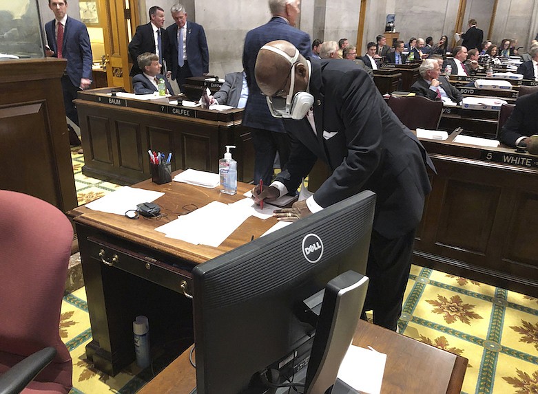 State Rep. G.A. Hardaway, D-Memphis, wears a mask during House floor proceedings in Nashville, Tenn., Thursday, March 19, 2020, amid the coronavirus pandemic. (AP Photo/Jonathan Mattise)