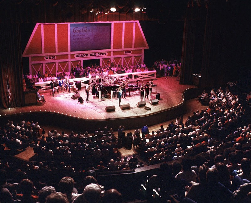 FILE - This undated file photo shows The Grand Ole Opry, the longest continuously running radio show in the world, at the Grand Ole Opry House in Nashville, Tenn. The Grand Ole Opry is playing on through the coronavirus spread. The country music institution, which has been airing Saturday nights for 94 years, is set to broadcast live on television this Saturday from a mostly empty venue. Country singer Marty Stuart will be performing with just a guitar and a mandolin. (AP Photo/Mark Humphrey, File)


