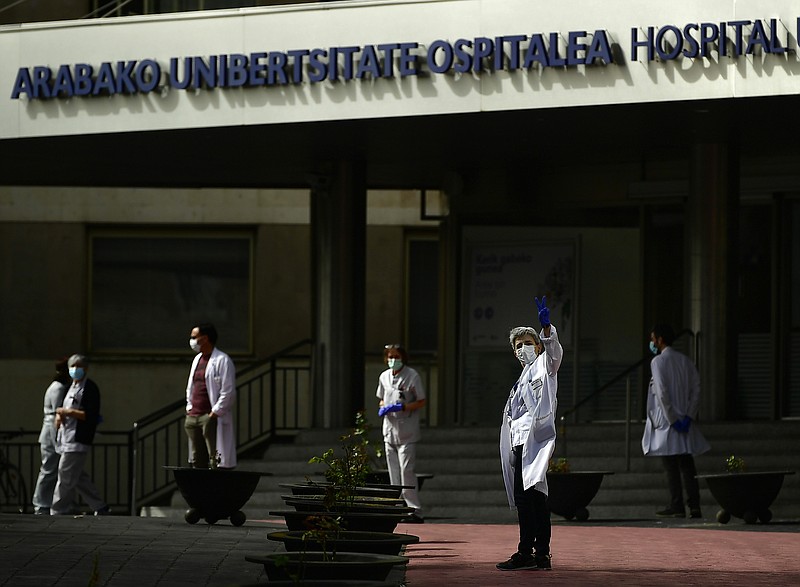 Health services staff members protest outside the Txagorritxu hospital demanding more protection equipment, after a Spanish nurse died Thursday from coronavirus COVID-19 in a hospital, in Vitoria, northern Spain, Friday March 20, 2020. Spain will mobilise 200 billion euros for workers and vulnerable citizens, Prime Minister Pedro Sanchez announced Tuesday. For many people the coronavirus causes mild or moderate symptoms, but for some it causes more severe illness, especially in older adults and people with existing health problems. (AP Photo/Alvaro Barrientos)


