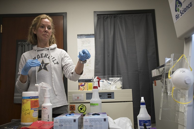 Staff photo by Troy Stolt / Baylor teacher Dr. Elizabeth Forrester, stands in her lab area in Baylor School on Wednesday, March 18, 2020 in Chattanooga, Tenn. Last Friday Dr. Forrester and her teaching colleague Dr. Dawn Richards were able to confirm that with Baylor's Schools lab equipment, they would be able to run tests to determine whether or not someone has coronavirus.