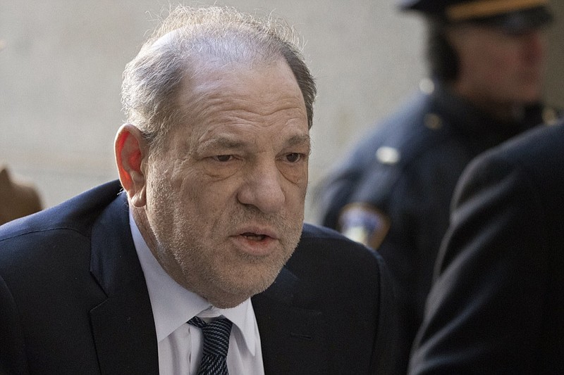 FILE - In this Feb. 21, 2020, file photo, Harvey Weinstein arrives at a Manhattan court as jury deliberations continue in his rape trial in New York. Weinstein tested positive for the coronavirus at a state prison in New York while serving a 23-year sentence for rape and sexual assault, the head of the state correctional officers union said Monday. (AP Photo/Mark Lennihan, File)