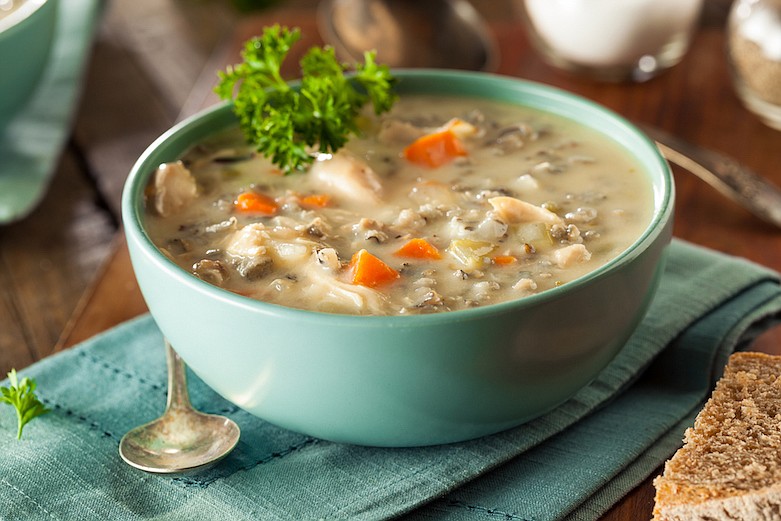 Homemade Wild Rice and Chicken Soup in a bowl. / Getty Images/iStock/bhofack2