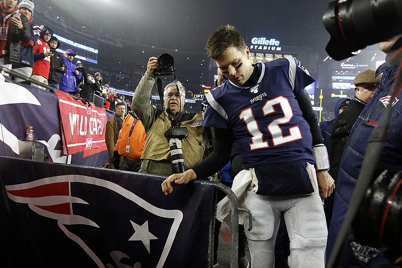 AP photo by Bill Sikes / Veteran quarterback Tom Brady leaves the field at Gillette Stadium in Foxborough, Mas., after what proved to be his final game after 20 seasons with the New England Patriots, an upset loss to the Tennessee Titans on Jan. 4.