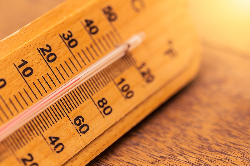 hot day summer concept closeup thermometer with warm color tone - stock photo thermometer tile temperature tile summer heat hot / Getty Images
