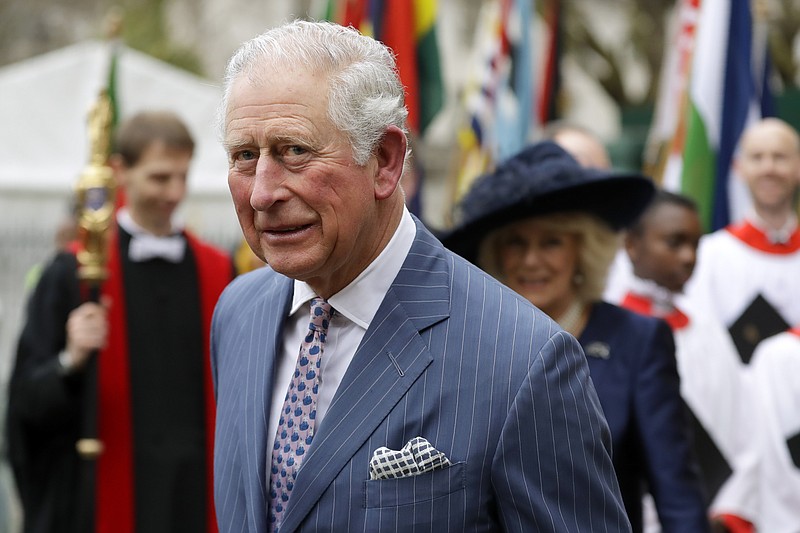 FILE - In this Monday, March 9, 2020 file photo, Britain's Prince Charles and Camilla the Duchess of Cornwall, in the background, leave after attending the annual Commonwealth Day service at Westminster Abbey in London, Monday, March 9, 2020. Prince Charles, the heir to the British throne, has tested positive for the new coronavirus. The prince's Clarence House office reported on Wednesday, March 25, 2020 that the 71-year-old is showing mild symptoms of COVID-19 and is self-isolating at a royal estate in Scotland. For most people, the coronavirus causes mild or moderate symptoms, such as fever and cough that clear up in two to three weeks (AP Photo/Kirsty Wigglesworth, File)

