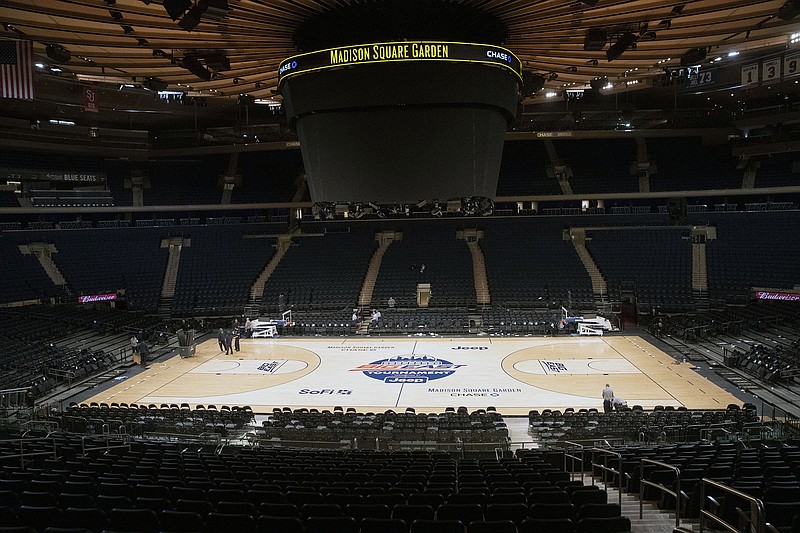 Madison Square Garden is shown after NCAA college basketball games in the men's Big East Conference tournament were cancelled due to concerns about the coronavirus, Thursday, March 12, 2020, in New York. The major conferences in college sports have all cancelled their basketball tournaments because of the new coronavirus, putting the celebrated NCAA Tournament in doubt. (AP Photo/Mary Altaffer)