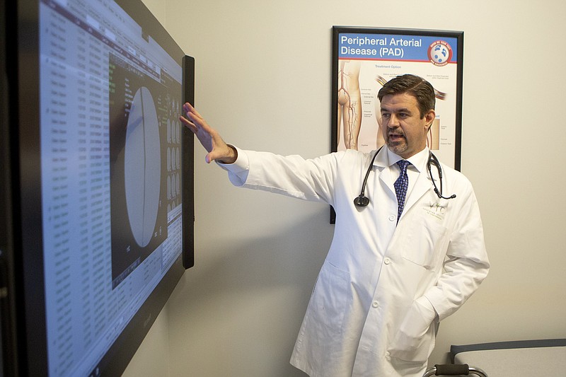 Staff photo illustration by C.B. Schmelter / Dr. Chris LeSar demonstrates the usage of a Microsoft Hub at the Vascular Institute of Chattanooga to the Times Free Press on Thursday, Feb. 27, 2020 in Chattanooga, Tenn.