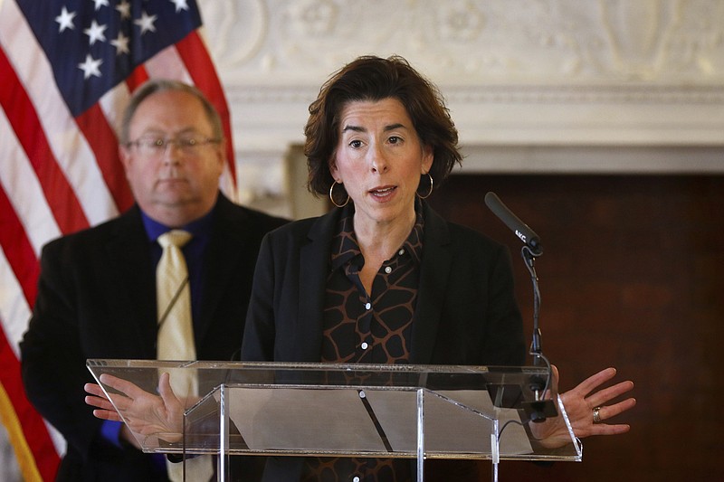 FILE - In this Sunday, March 22, 2020 file photo, Gov. Gina Raimondo gives an update on the coronavirus during a news conference in the State Room of the Rhode Island State House in Providence, R.I. Amid the continuing COVID-19 coronavirus outbreak, Raimondo is warning that the virus' widening economic fallout could lead to government layoffs in a state that already was facing a $200 million shortfall. Rhode Island lawmakers also approved borrowing up to $300 million to help the state cover its bills. (Kris Craig/Providence Journal via AP, Pool)


