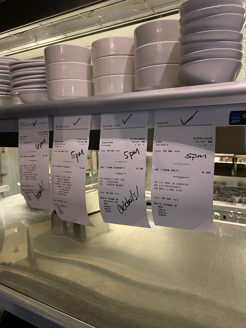 Contributed Photo / Tickets for pickup orders line up at Public House, where family-size takeout meals are becoming increasingly popular since the coronavirus threat has closed dine-in service at area restaurants.