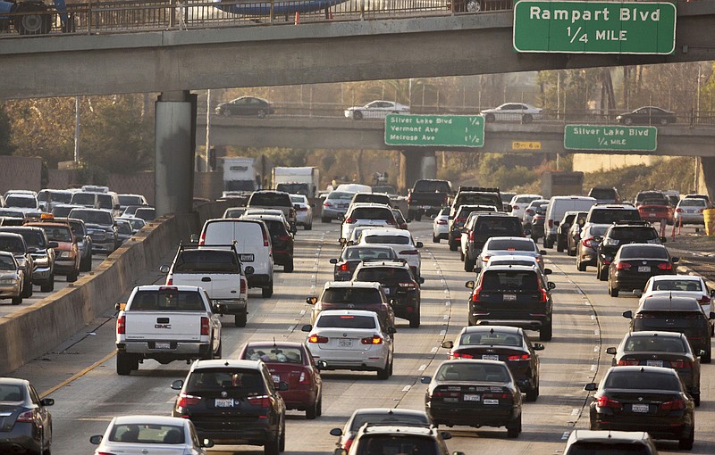 FILE - This Dec. 12, 2018, file photo shows traffic on the Hollywood Freeway in Los Angeles. President Donald Trump's is expected to mark a win in his two-year fight to gut one of the United States' single-biggest efforts against climate change, relaxing ambitious Obama-era vehicle mileage standards and raising the ceiling on damaging fossil fuel emissions for years to come. (AP Photo/Damian Dovarganes, File)