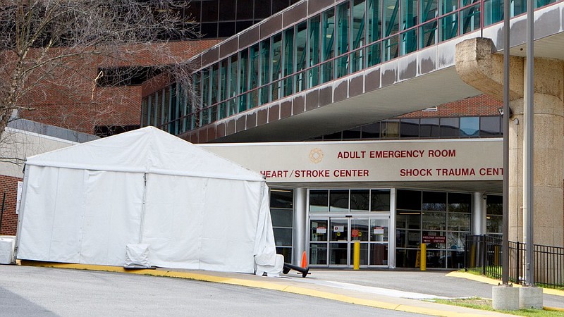 Staff photo by C.B. Schmelter / Tents are seen being set up outside of the adult emergency room at Erlanger on Monday, March 30, 2020 in Chattanooga, Tenn.