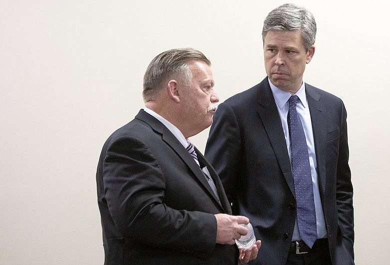 Mayor Jim Coppinger, left, and Mayor Andy Berke chat before a press conference at the McDaniel Building on Friday, March 13, 2020, in Chattanooga, Tenn. / Staff photo by C.B. Schmelter