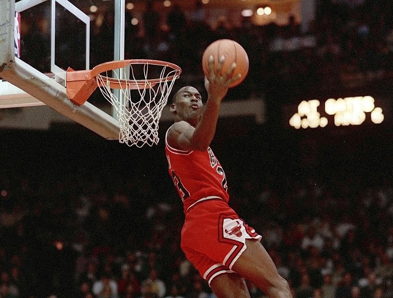 FILE - In this Feb. 6, 1988, file photo, Chicago Bulls' Michael Jordan dunks during the slam-dunk competition of the NBA All-Star weekend in Chicago. Jordan left the old Chicago Stadium that night with the trophy. To this day, many believe Wilkins was the rightful winner. (AP Photo/John Swart)