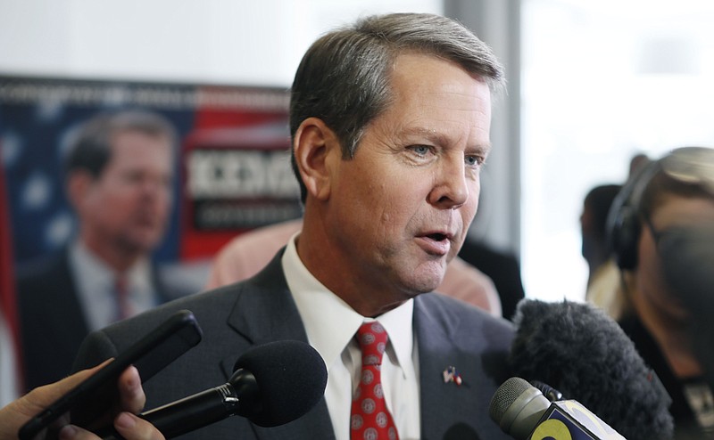 Secretary of State Brian Kemp speaks to the media after he rolled out a new policy aimed at veterans at a press conference at his Atlanta headquarters in Atlanta on Aug. 29, 2018. (Bob Andres/


