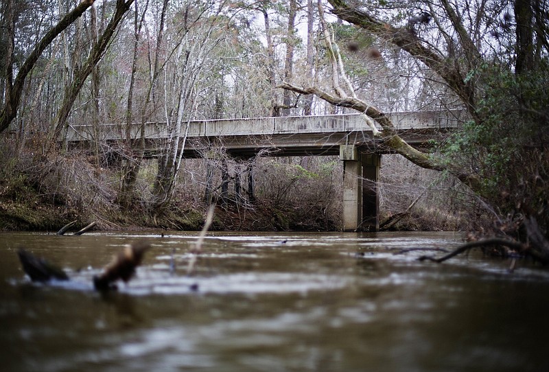 FILE- This Feb. 22, 2018, file photo shows, a bridge that spans the Apalachee River at Moore's Ford Road where in 1946 two young black couples were stopped by a white mob who dragged them to the riverbank and shot them multiple times in Monroe, Ga. (AP Photo/David Goldman, File)


