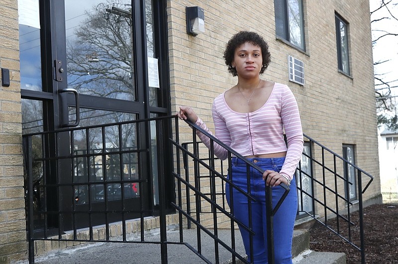 Jade Brooks at her apartment, Tuesday, March 31, 2020, in Boston. It's the first of the month and everybody knows the rent's due. Wednesday is the first time the landlord is knocking on the door since the coronavirus turned the economy upside down. (AP Photo/Elise Amendola)

