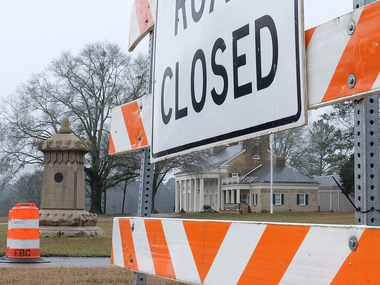 A road closure sign frames the older portion of the Chickamauga Battlefield visitors center in this view, Jan. 4, 2019. The center is closed due to a partial government shutdown that has idled national parks for two weeks. The road closure is unrelated. / Staff file photo by Tim Barber