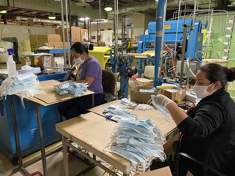 Contributed photo / Workers at eSpin Technologies in Chattanooga make disposable surgical face masks.