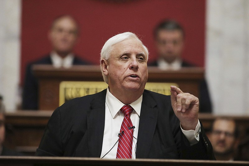 FILE - In a Wednesday, Jan. 8, 2020 file photo, West Virginia Governor Jim Justice delivers his annual State of the State address in the House Chambers at the state capitol, in Charleston, W.Va. Gov. Justice said during a media briefing Wednesday, March 4, 2020, at the state Capitol in Charleston that state residents should live their normal lives and not cancel travel plans despite the emerging threat of the new coronavirus. There are no known cases of the virus thus far in West Virginia. (AP Photo/Chris Jackson, File)


