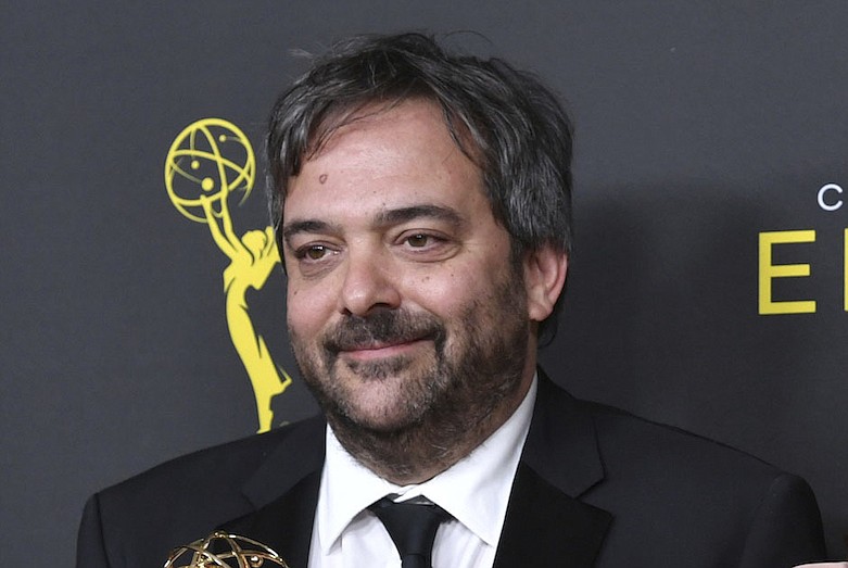 This Sept. 14, 2019 file photo shows Adam Schlesinger, winner of the awards for outstanding original music and lyrics for "Crazy Ex Girlfriend," in the press room at the Creative Arts Emmy Awards in Los Angeles. Schlesinger, an Emmy and Grammy winning musician and songwriter known for his band Fountains of Wayne and his songwriting on the TV show "Crazy Ex-Girlfriend," has died from coronavirus at age 51. (Photo by Richard Shotwell/Invision/AP, File)