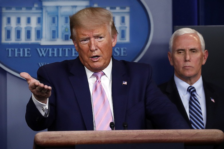 President Donald Trump speaks about the coronavirus in the James Brady Press Briefing Room of the White House, Wednesday, April 1, 2020, in Washington, as Vice President Mike Pence listens. (AP Photo/Alex Brandon)