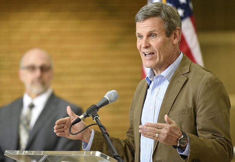 Staff Photo by Robin Rudd / Tennessee Governor Bill Lee held a press briefing at the UTC University Center, concerning the COVID-19 pandemic, on April 3, 2020. Listening in the background is Dr. Tim Jones Cheif Medical Officer for the state.