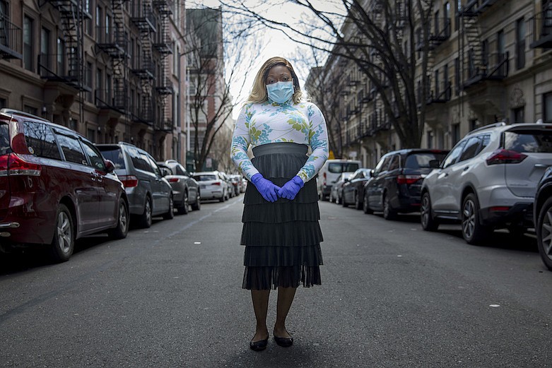 Tiffany Pinckney poses for a portrait in the Harlem neighborhood of New York on April 1, 2020. After a period of quarantine at home separated from her children, she has recovered from COVID-19. Pinckney became one of the nations first donors of "convalescent plasma." Doctors around the world are dusting off a century-old treatment for infections: Infusions of blood plasma teeming with immune molecules that helped survivors beat the new coronavirus. (AP Photo/Marshall Ritzell)