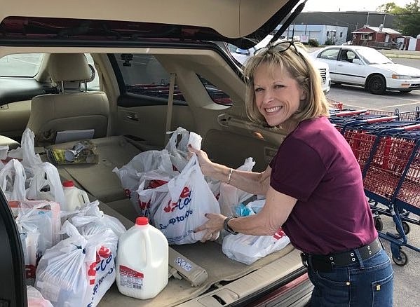 Contributed photo by Janice Williams / Volunteer Joy Morris shopping for groceries Friday afternoon at Save-A-Lot in Walker County, Georgia. 
