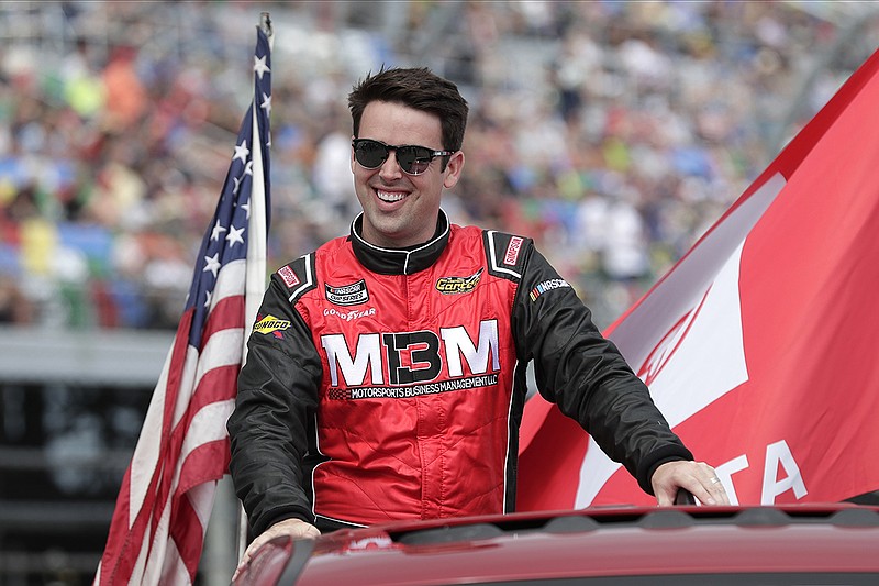 AP photo by John Raoux / NASCAR Cup Series driver Timmy Hill takes a parade lap in front of fans before the Daytona 500 on Feb. 16 at Daytona International Speedway in Daytona Beach, Fla. Hill won a NASCAR virtual race last weekend on a simulated Texas Motor Speedway track.