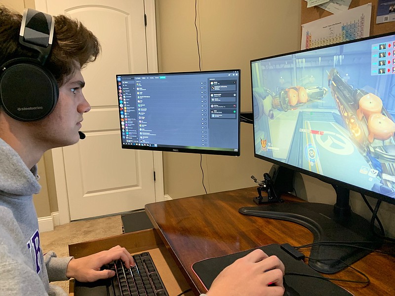Contributed photo / McCallie senior Denver Oliver plays "Overwatch" from his home recently during the COVID-19 crisis. Oliver helped the Blue Tornado esports team achieve national success this year playing the popular first-person shooter video game.