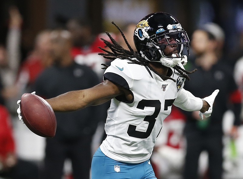 AP Images for Panini photo by Michael Zarrilli / Former East Hamilton and Vanderbilt cornerback Tre Herndon celebrates an interception for the Jacksonville Jaguars in a game last December against the host Atlanta Falcons. Herndon and his girlfriend recently pledged a donation that will provide thousands of meals for Floridians affected by the COVID-19 pandemic.