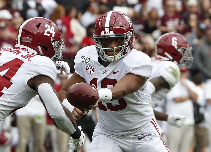Alabama photo by Kent Gidley / Former Alabama quarterback Tua Tagovailoa, shown here handing off to Brian Robinson during last year's win at Texas A&M, is the biggest gamble in the history of the NFL draft according to former New York Jets coach Rex Ryan.