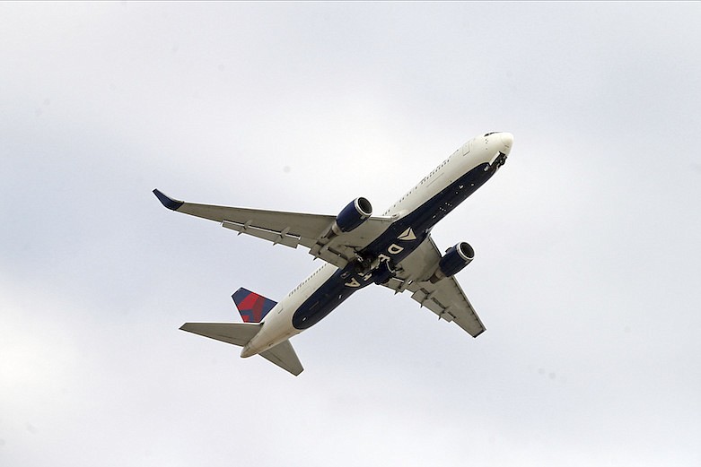 A Delta Airlines plane takes off from Minneapolis-St. Paul International Airport Friday, March 27, 2020, in Minneapolis. President Donald Trump is expected to sign a bill passed in the House and Senate which grants billions in loans and loan guarantees for passenger airlines which are affected by the coronavirus pandemic. The new coronavirus causes mild or moderate symptoms for most people, but for some, especially older adults and people with existing health problems, it can cause more severe illness or death. (AP Photo/Jim Mone)