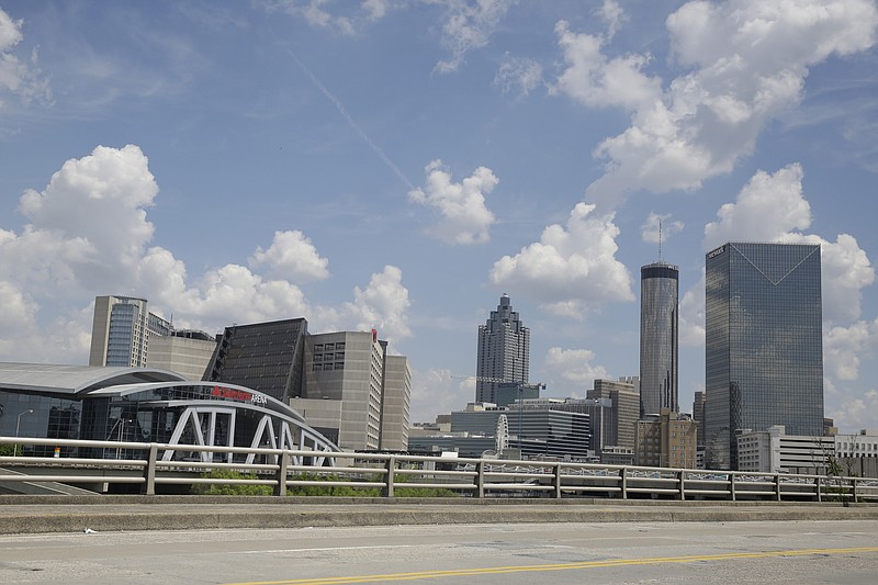 StateFarm Arena is seen near an empty street where the men's NCAA Final Four NCAA college basketball championship game was to be played on Monday, April 6, 2020, in Atlanta. The entire NCAA tournament was canceled due to the COVID-19 virus. (AP Photo/Brynn Anderson)


