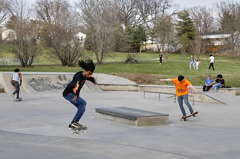 In this April 6, 2020 photo, skateboarders are seen in a park in Omaha, Neb. As most governors have imposed stay-at-home orders that public health officials say are essential to slowing the spread of the new coronavirus, leaders in a handful of states have steadfastly refused to take the action, arguing it's unneeded and potentially harmful. (AP Photo/Nati Harnik)



