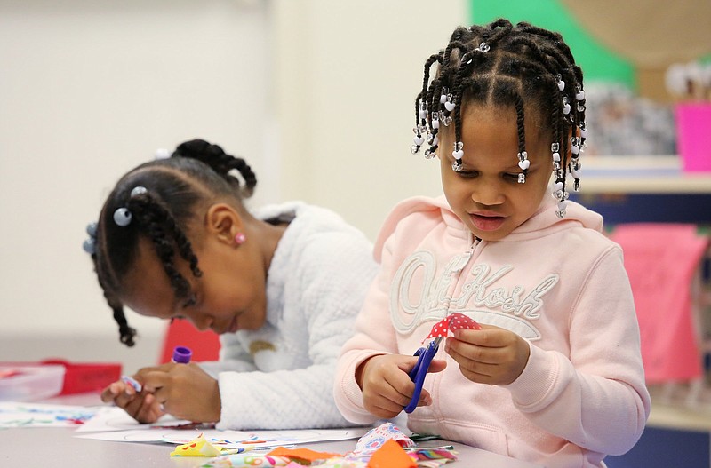 Kyle Lee, 5, and Venus Johnson, 4, decorate the letter "Q" as they learn letters at Champion Christian Learning Center, speaks with Chattanooga Mayor Andy Berke about expanding at Champion Christian Learning Academy Monday, April 1, 2019 in Chattanooga, Tennessee. The learning center was opened in 2017 to help prepare kids for kindergarten with behavioral and school knowledge.