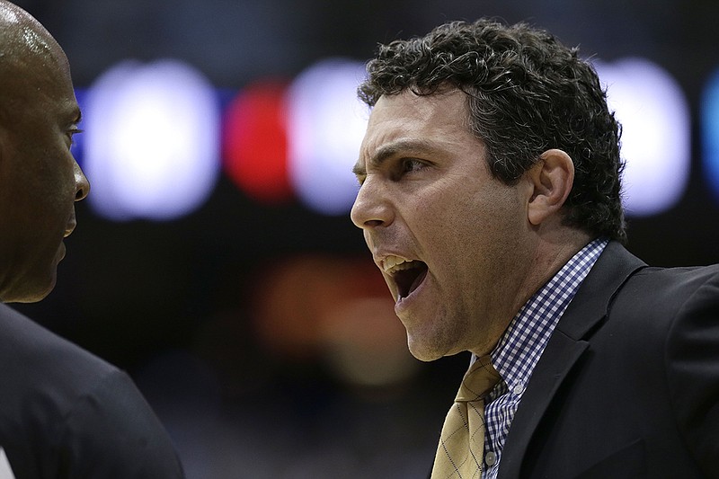 AP photo by Gerry Broome / Georgia Tech men's basketball coach Josh Pastner argues with an official during an ACC matchup on Jan. 4 at North Carolina.