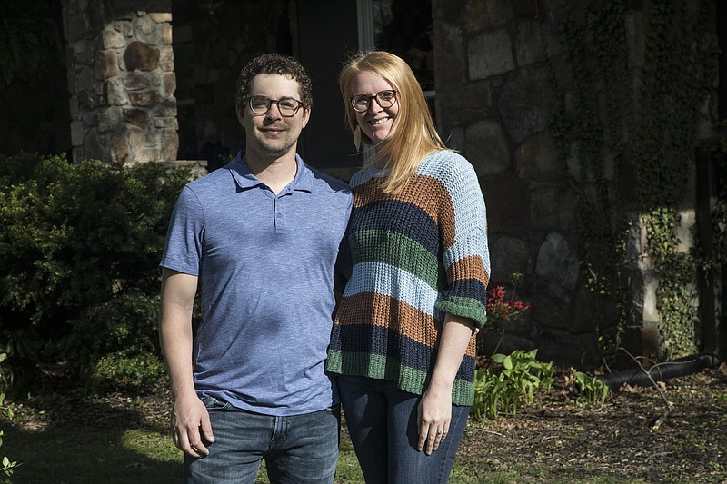 Staff photo by Troy Stolt / Thomas and Shannon Connolly pose for a portrait in front of their home on Thursday, April 9, 2020 in Signal Mountain, Tenn.