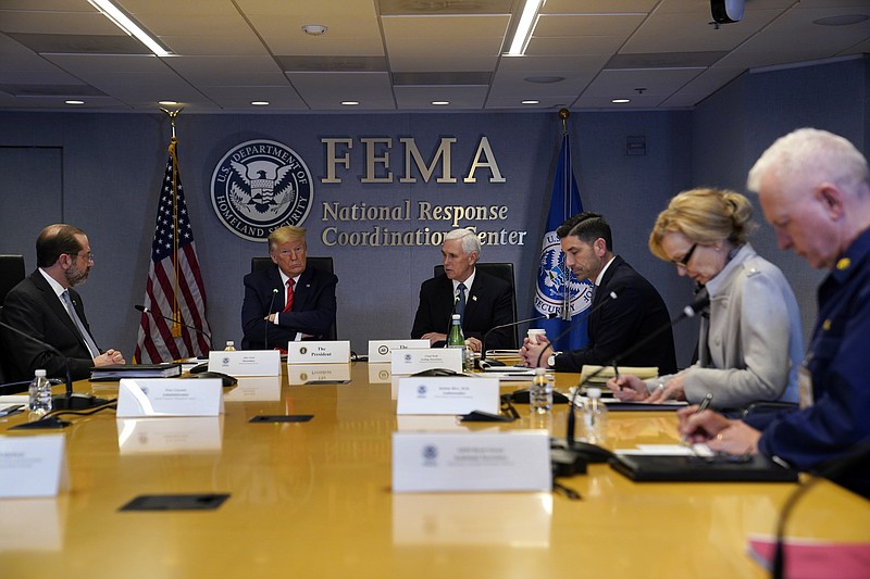 FILE - In this March 19, 2020, file photo, President Donald Trump attends a teleconference with governors at the Federal Emergency Management Agency headquarters, Thursday, March 19, 2020, in Washington. From left, Department of Health and Human Services Secretary Alex Azar, Trump, Vice President Mike Pence, Acting Secretary of Homeland Security Chad Wolf, White House coronavirus response coordinator Dr. Deborah Birx and Adm. Brett Giroir, assistant secretary for health. There's the standard process for getting urgently needed coronavirus equipment: send a request to FEMA. Then there's the other way: have a buddy who can pick up the phone and call the Trump White House. Trump's team has proudly recounted instances where a call to the White House has produced fast results for those who have an in with the president. (AP Photo/Evan Vucci, Poolm, File)


