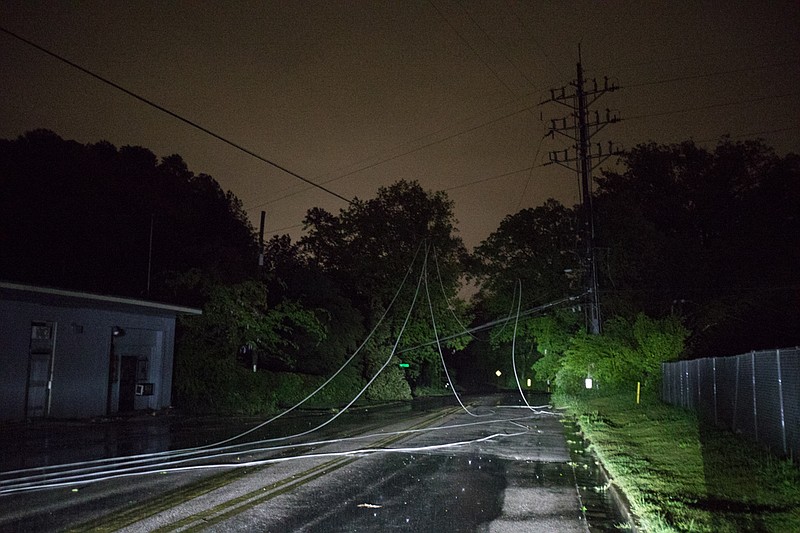 Staff Photo by Troy Stolt / Downed power lines block Shallowford Road after severe storms hit the area early Monday in Chattanooga, Tenn. on Monday, April 13, 2020. 